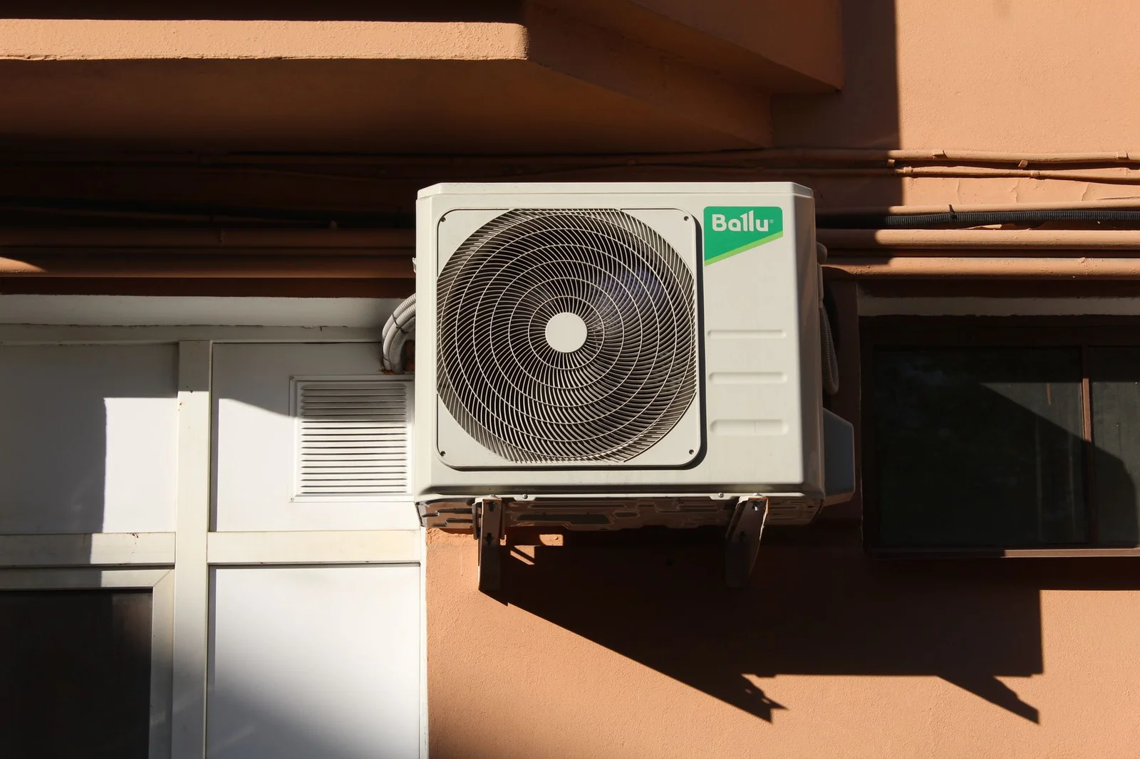 Ductless mini split indoor unit mounted in a bedroom